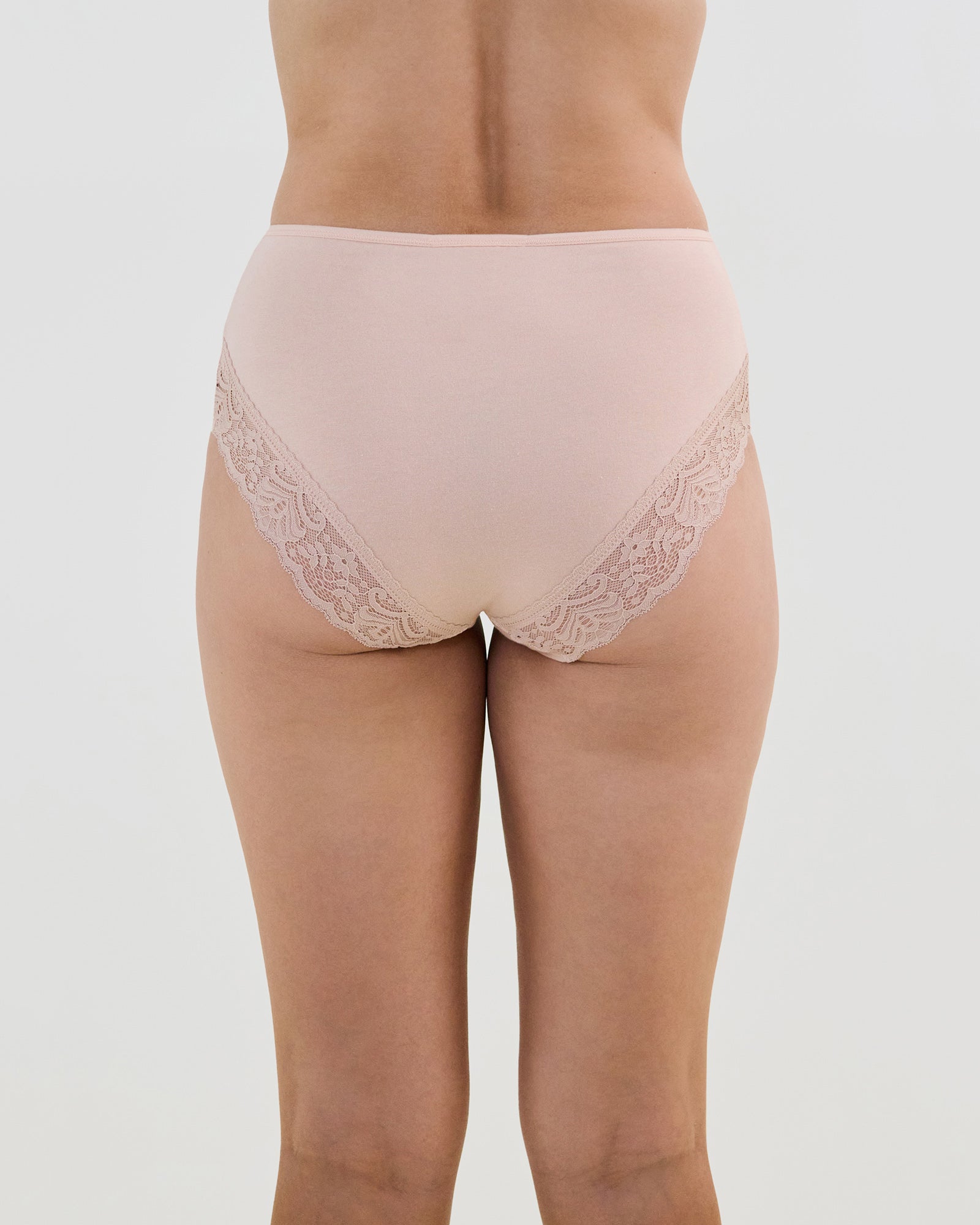 Model wears Cotton And Lace Full Brief in LATTE. On body back view