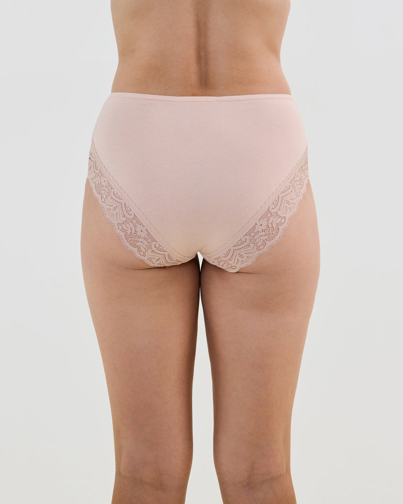 Model wears Cotton And Lace Full Brief in LATTE. On body back view