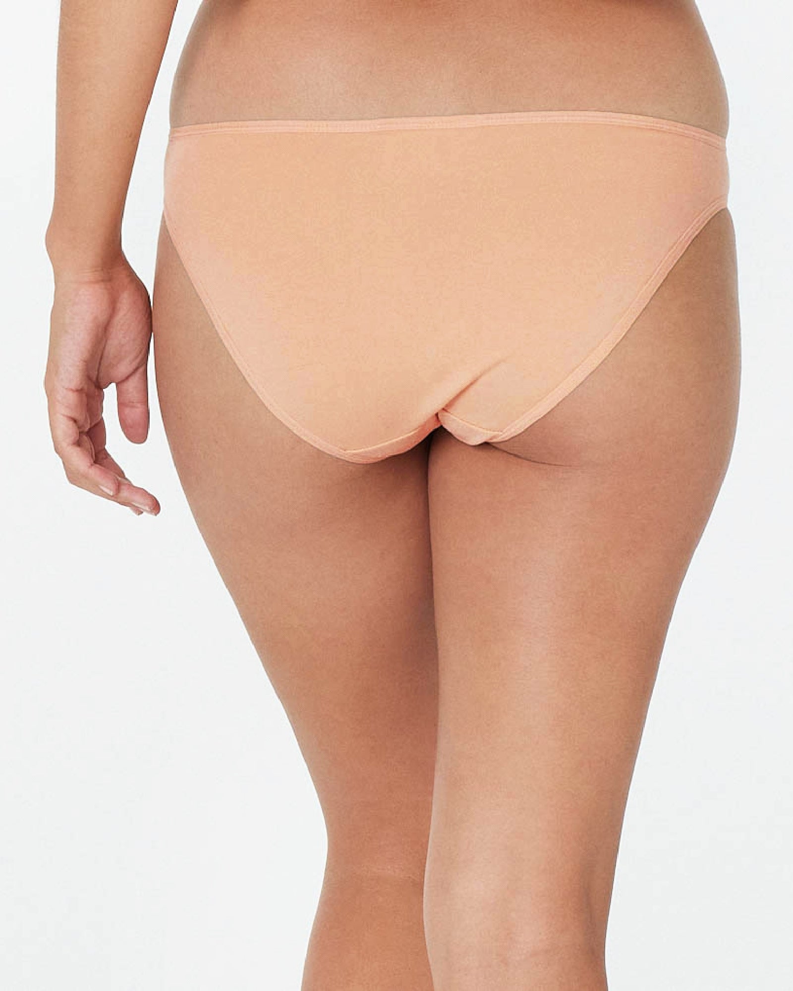 Model wears Clemence Bikini in LATTE. On body back view