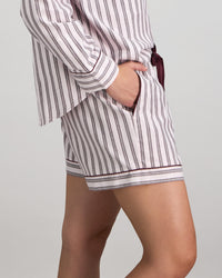 Model wears Cosy Flannel Short Pj in PINK-A-BOO. On body side view