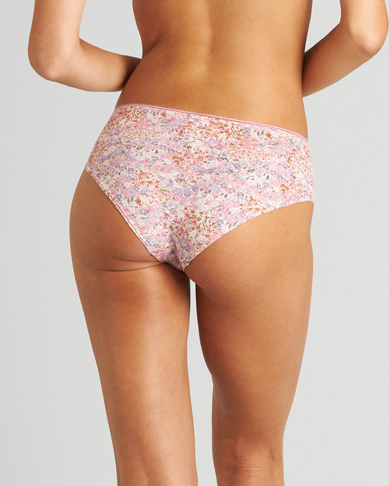 Model wears Rosemary Midi in ZEPHYR FLORAL PRINT. On body back view