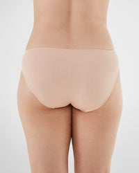 Model wears Embrace Bikini in LATTE. On body back view