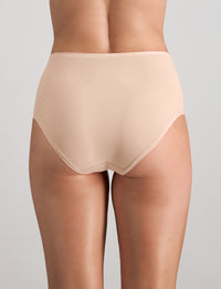 Model wears Extra-Ordinary Full Brief in LATTE. On body back view