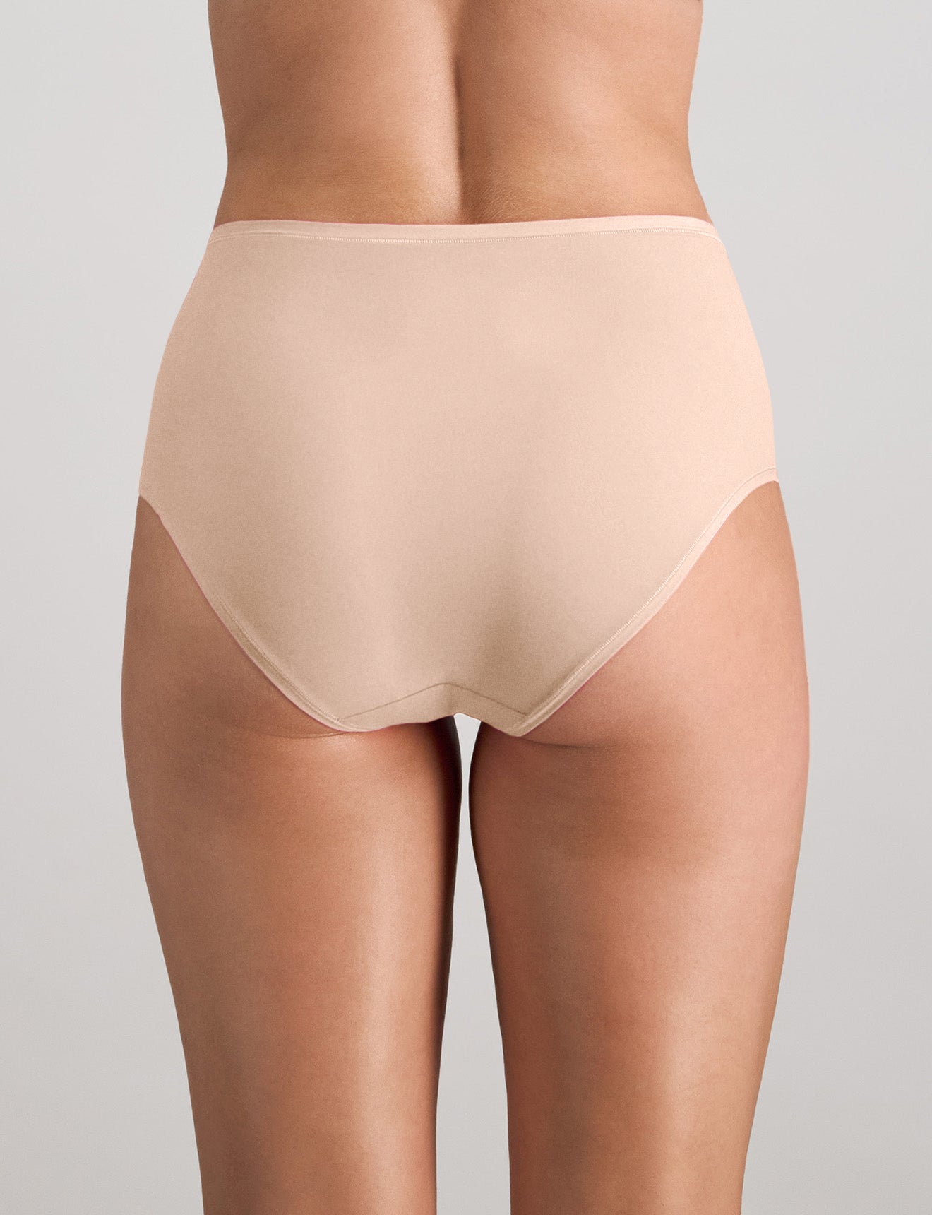 Model wears Extra-Ordinary Full Brief in LATTE. On body back view