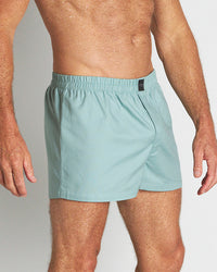Model wears Classic Woven Boxer in AQUIFER. On body side view