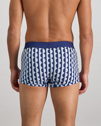 Model wears Retros Print Mens Trunk in OTHELLO PRINT. On body back view