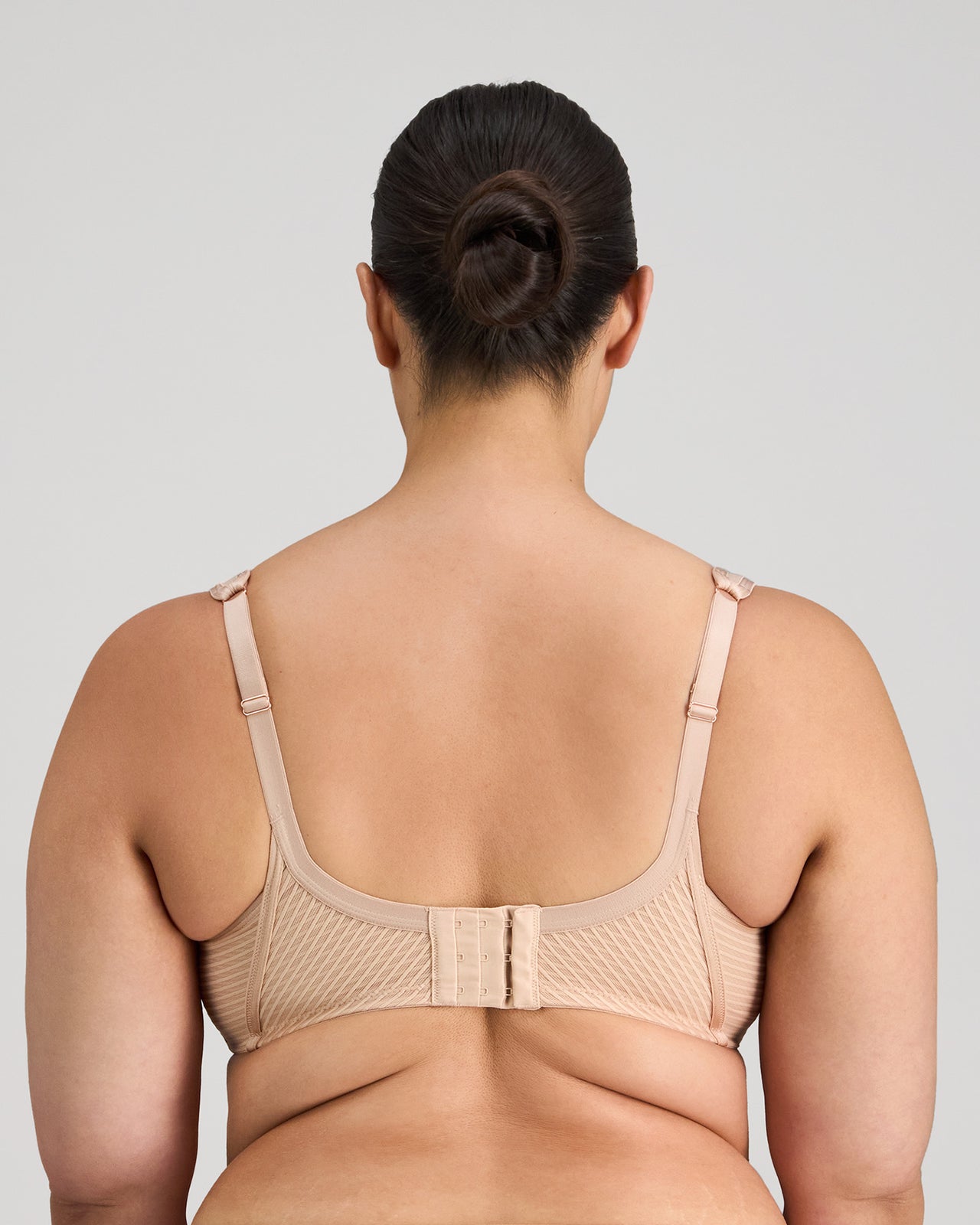 Model wears Perfect Lines Contour Bra in LATTE. On body back view