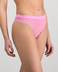 Model wears Lightweight High Cut Brief in BUBBLEGUM PINK. On body side view