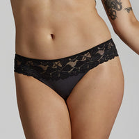 Model wears Captivate Me Bikini in BLACK. On body side view