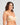 Model wears Bendon Bare Lace Back Strapless Bra in LATTE. On body side view