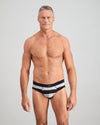 Model wears Rugby Stripe Mens Brief in BLACK RUGBY STRIPE. On body front view