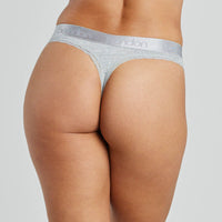 Model wears Cotton Logo Thong in GREY MARL. On body back view