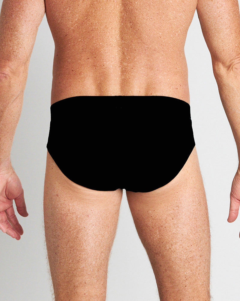 Model wears High Tech Cotton Mens Brief in BLACK. On body back view