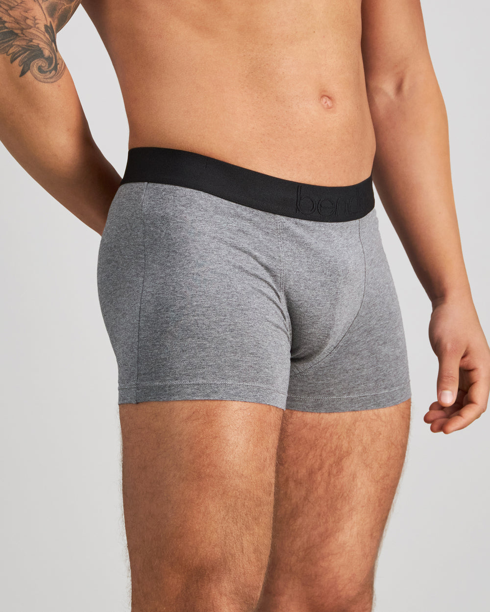 Model wears Everyday Essential Mens Trunk in GREY MARL. On body side view
