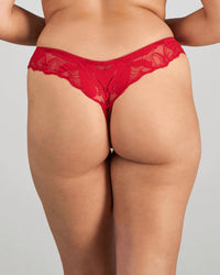 Model wears Margot Estelle Thong in JESTER RED. On body back view