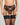 Model wears Romilly Suspender in BLACK. On body front view