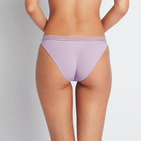 Model wears Stripe Elastic & Papertouch Tanga in CHALK VIOLET. On body back view
