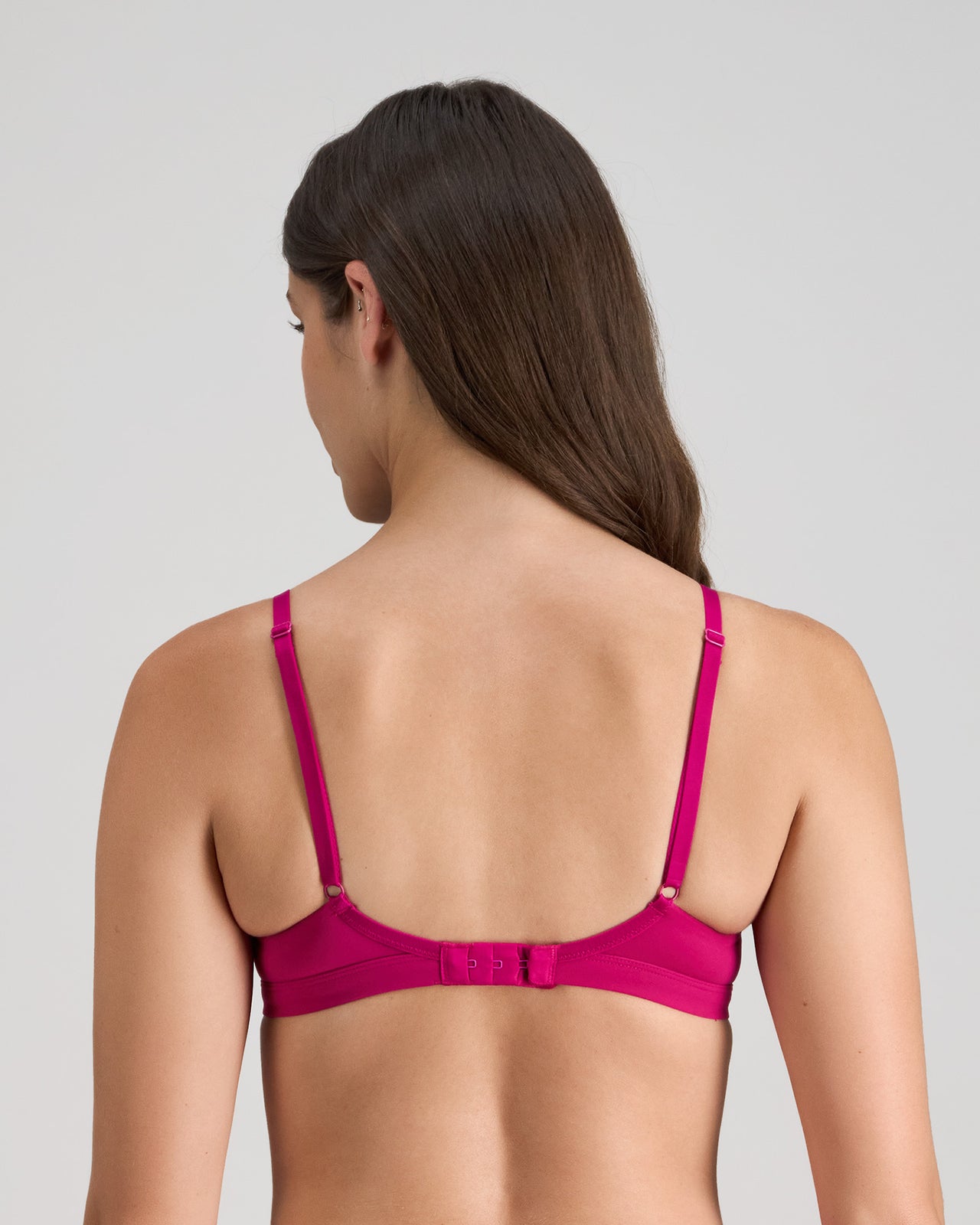 Model wears Extra-Ordinary Contour Bra in FANTASY FUCHSIA. On body back view