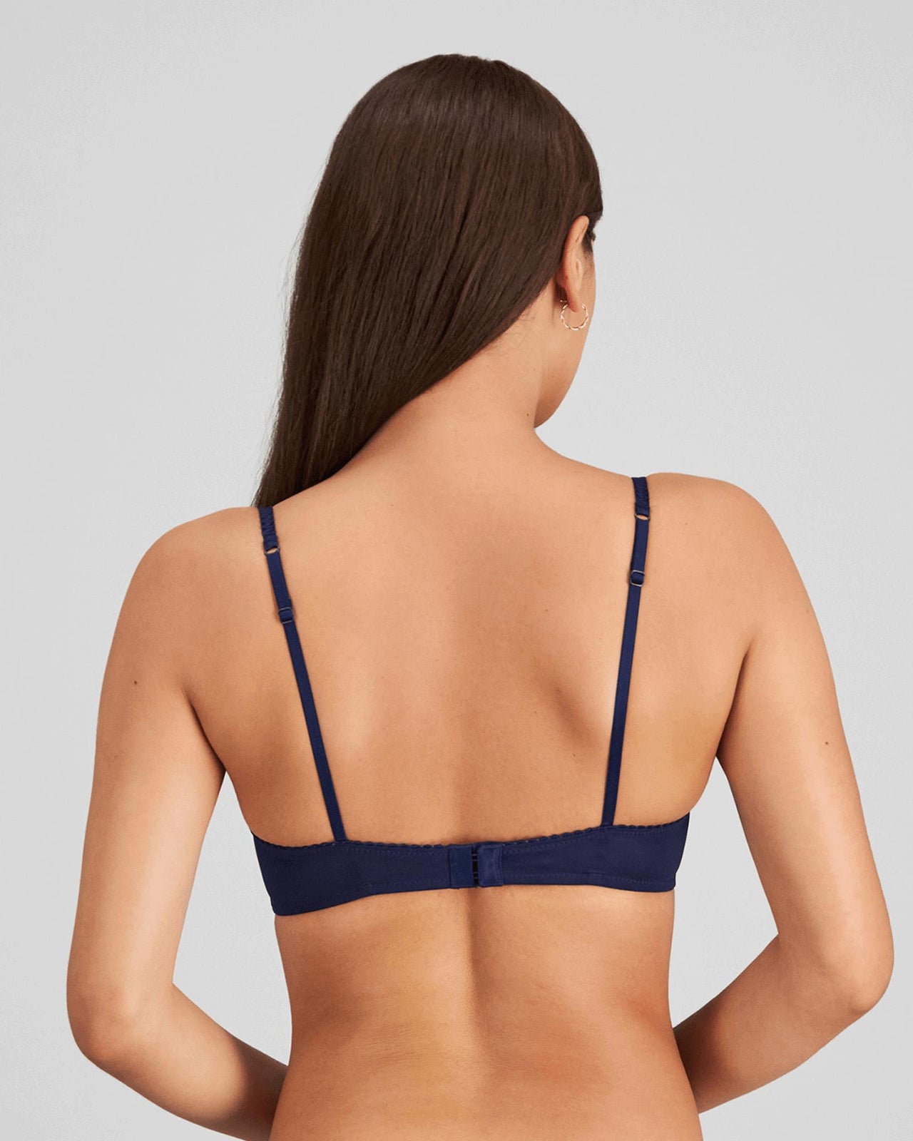 Model wears Sofia Underwire Bra in Medieval Blue. On body back view