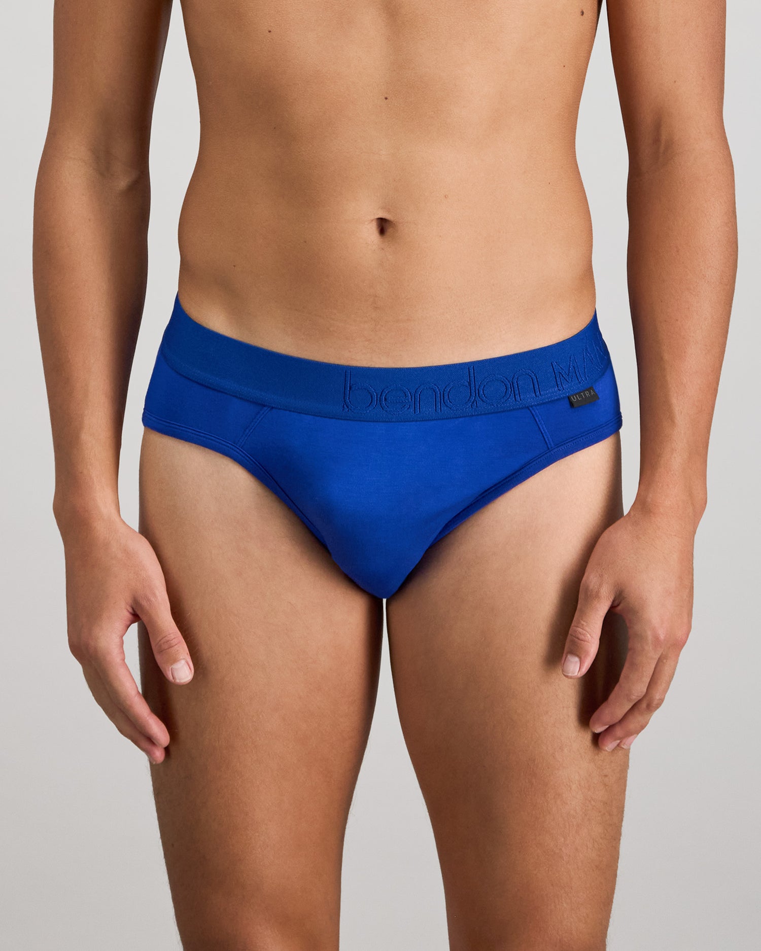 Model wears Bamboo Mens Brief in Surf The Web. On body front view