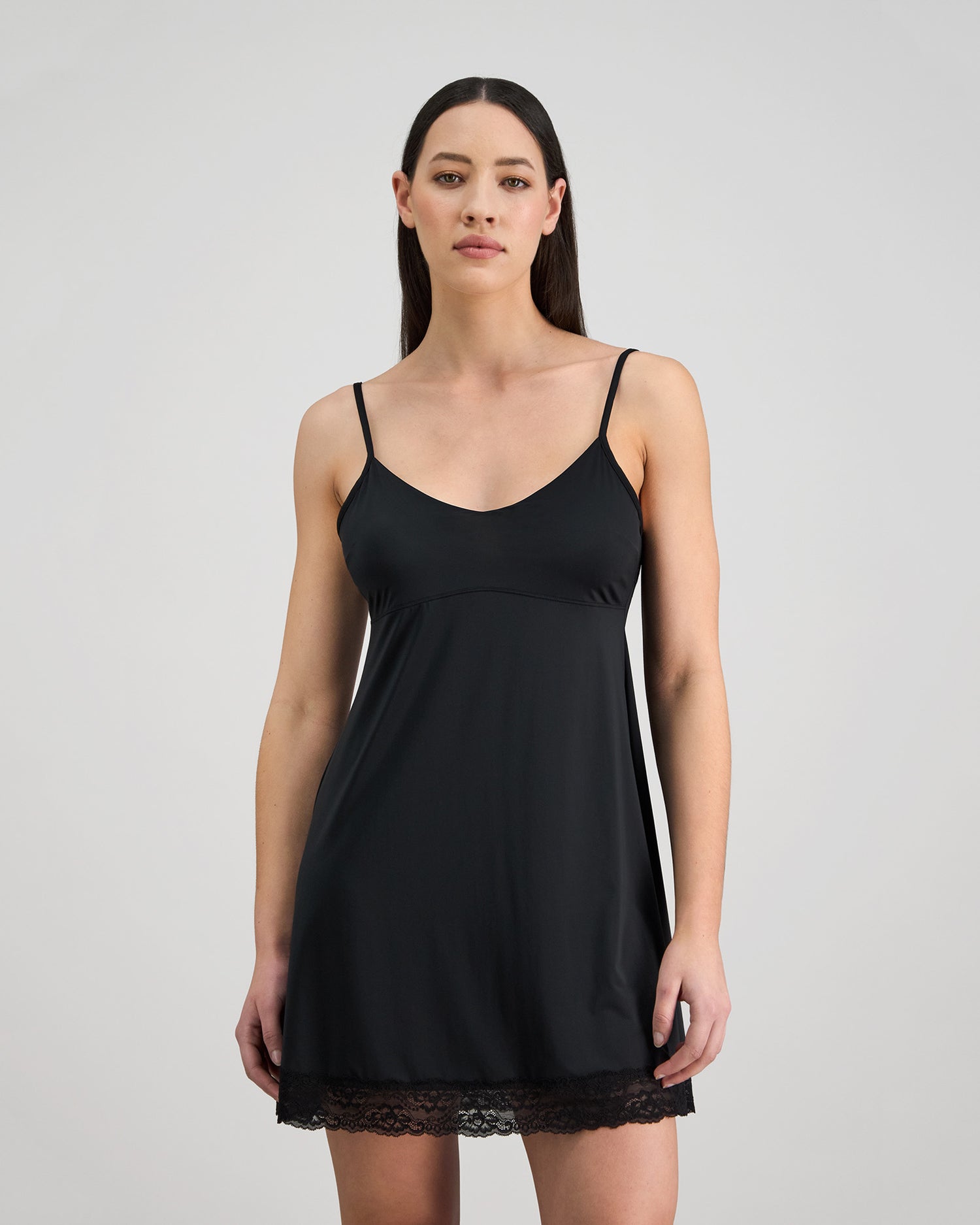 Model wears Understatement Slip in BLACK. On body front view