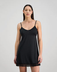 Model wears Understatement Slip in BLACK. On body front view