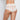Model wears Lace Full Brief in WHITE. On body back view