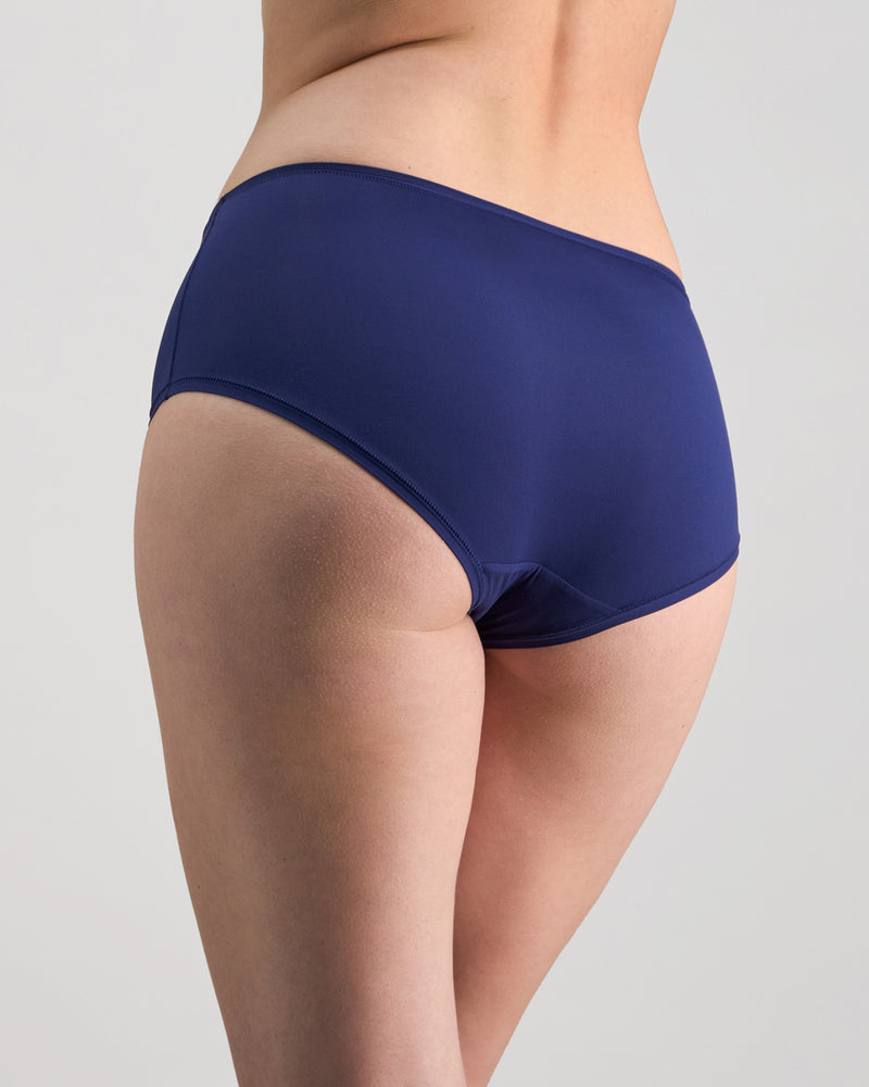 Model wears Extra-Ordinary Full Brief in Medieval Blue. On body back view