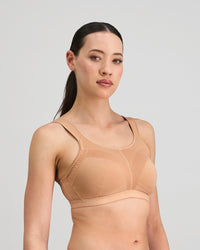 Model wears Stamina Wire Free Bra in LATTE. On body side view