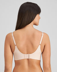 Model wears Flawless Form Contour Bra in LATTE. On body back view