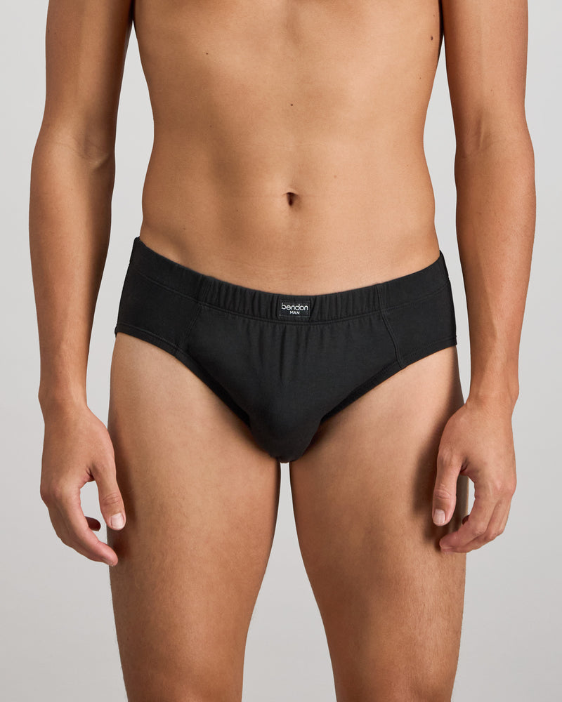 Model wears Cotton Stretch Mens Brief in BLACK. On body front view