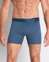 Model wears Bamboo Mens Trunk in BLUE WING TEAL. On body front view