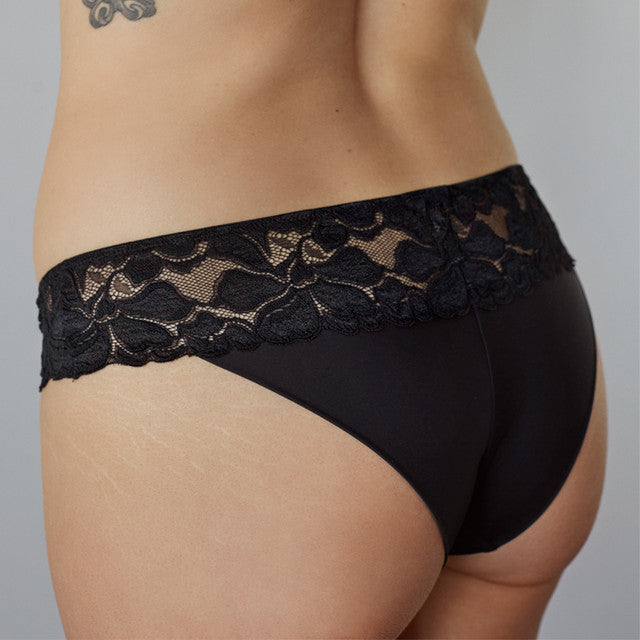 Model wears Captivate Me Bikini in BLACK. On body back view