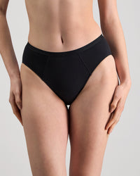 Model wears Body Cotton High Cut Brief in BLACK. On body front view