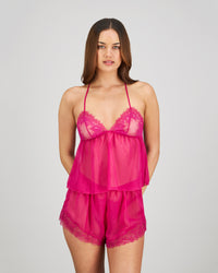 Model wears Eva Jean Short in FANTASY FUCHSIA. On body front view