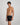 Model wears Cotton Texture Mens Trunk in BLACK. On body side view