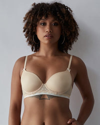 Model wears Geometric Lace Contour Bra in TOASTED ALMOND/PRISTINE. On body front view