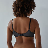 Model wears Elodie Maternity Bra in JET/PEWTER. On body back view