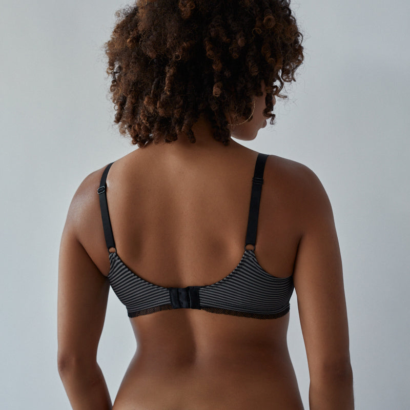 Model wears Elodie Maternity Bra in JET/PEWTER. On body back view