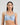 Model wears Coral Underwire Bra in SKYWAY. On body front view