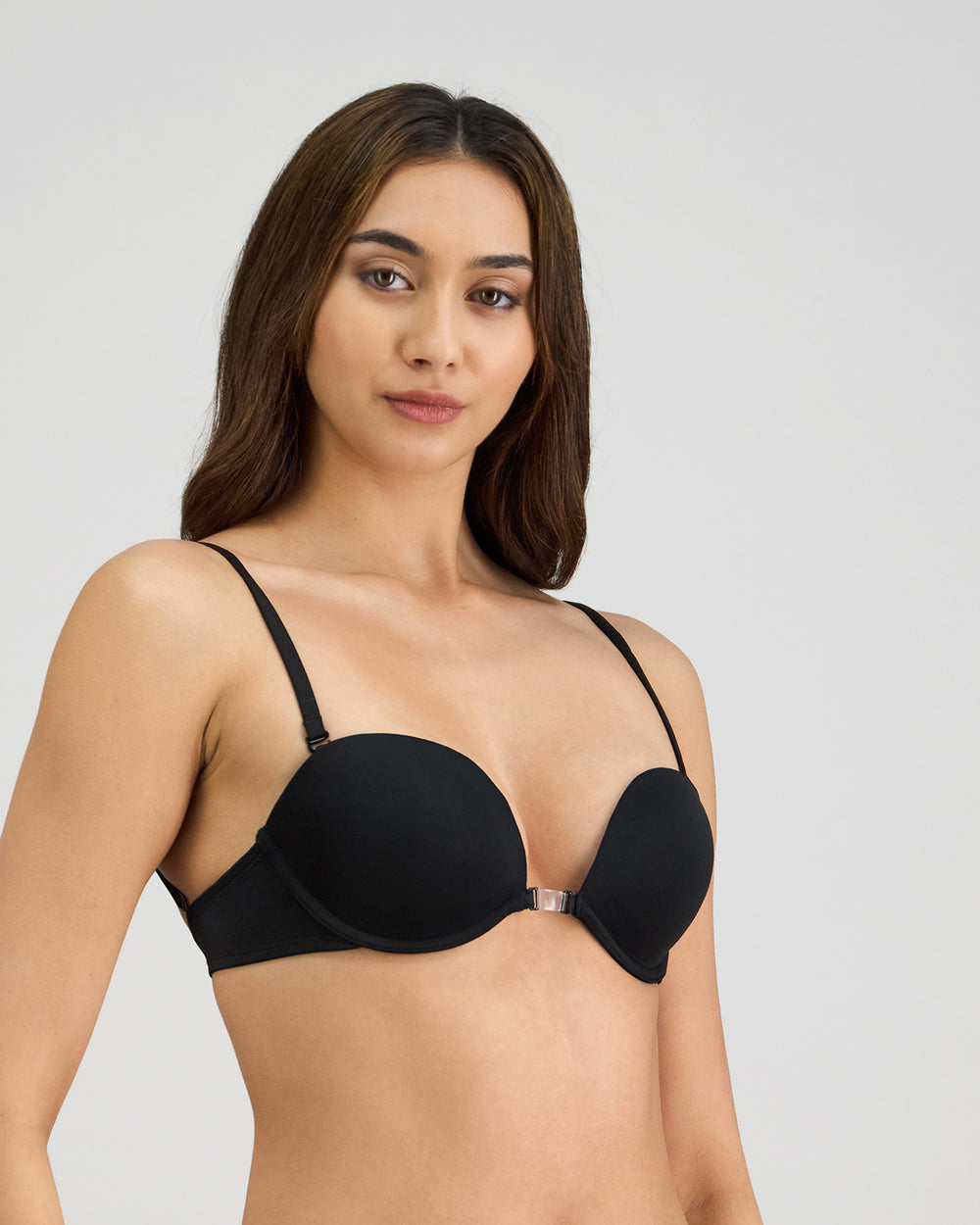Model wears Infinity Multiway Convertible Bra in BLACK. On body side view