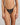 Model wears Lost Paradise Thong in BLACK PRINT. On body front view