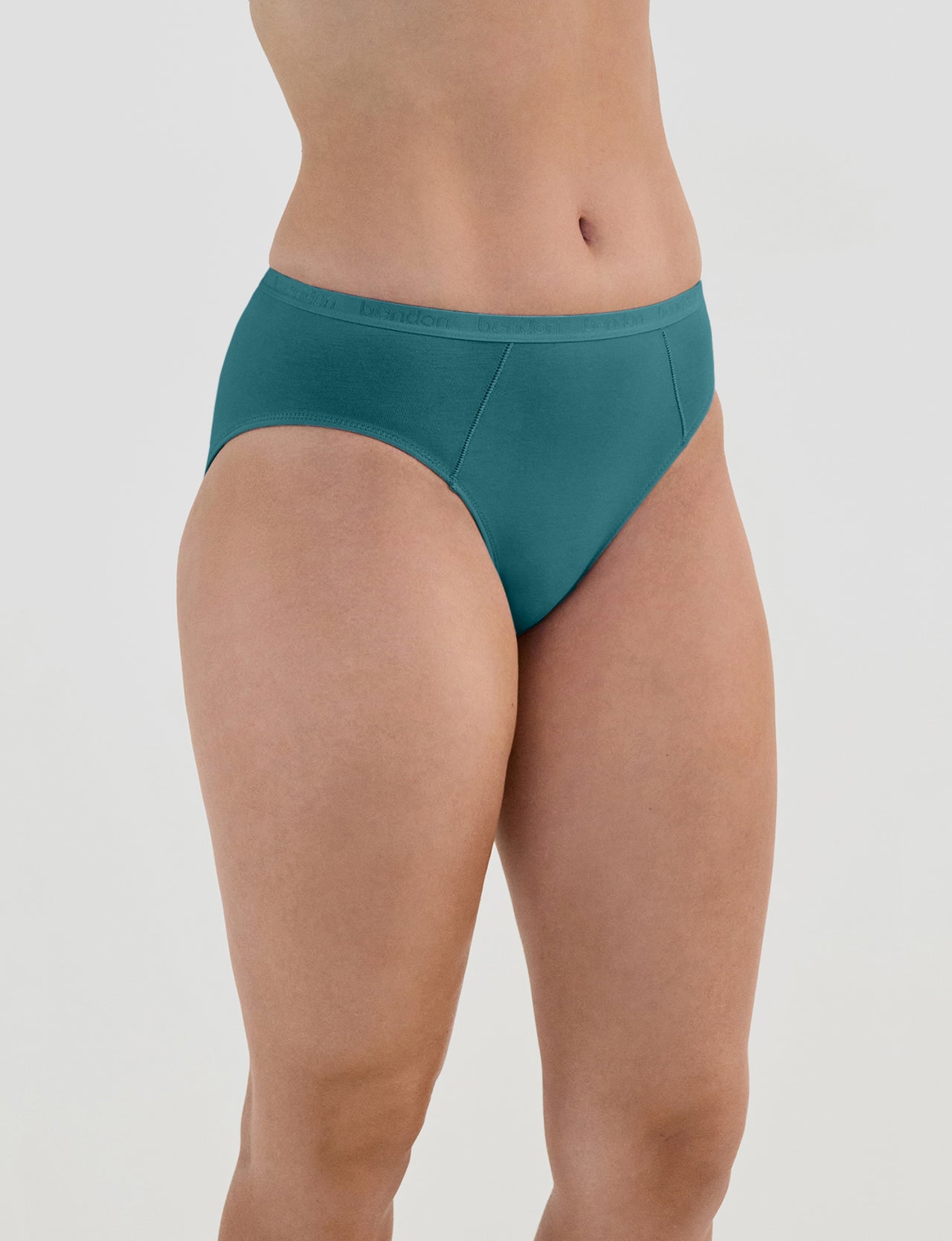 Model wears Body Cotton Bikini in RAIN FOREST. On body side view