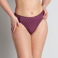 Model wears Rose Dot High Cut Brief in GRAPE WINE/ROSE CLOUD. On body front view