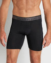 Model wears Everyday Active Mens Long Trunk in BLACK. On body front view