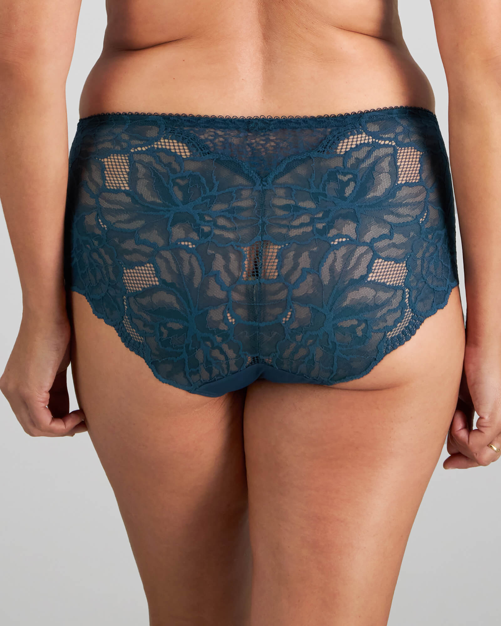 Model wears Midnight Express Full Brief in REFLECTING POND. On body back view