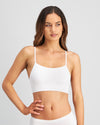 Model wears Simply Seamless Crop Top in WHITE. On body front view