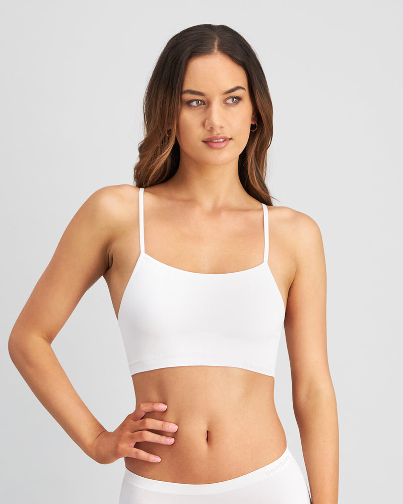 Model wears Simply Seamless Crop Top in WHITE. On body front view