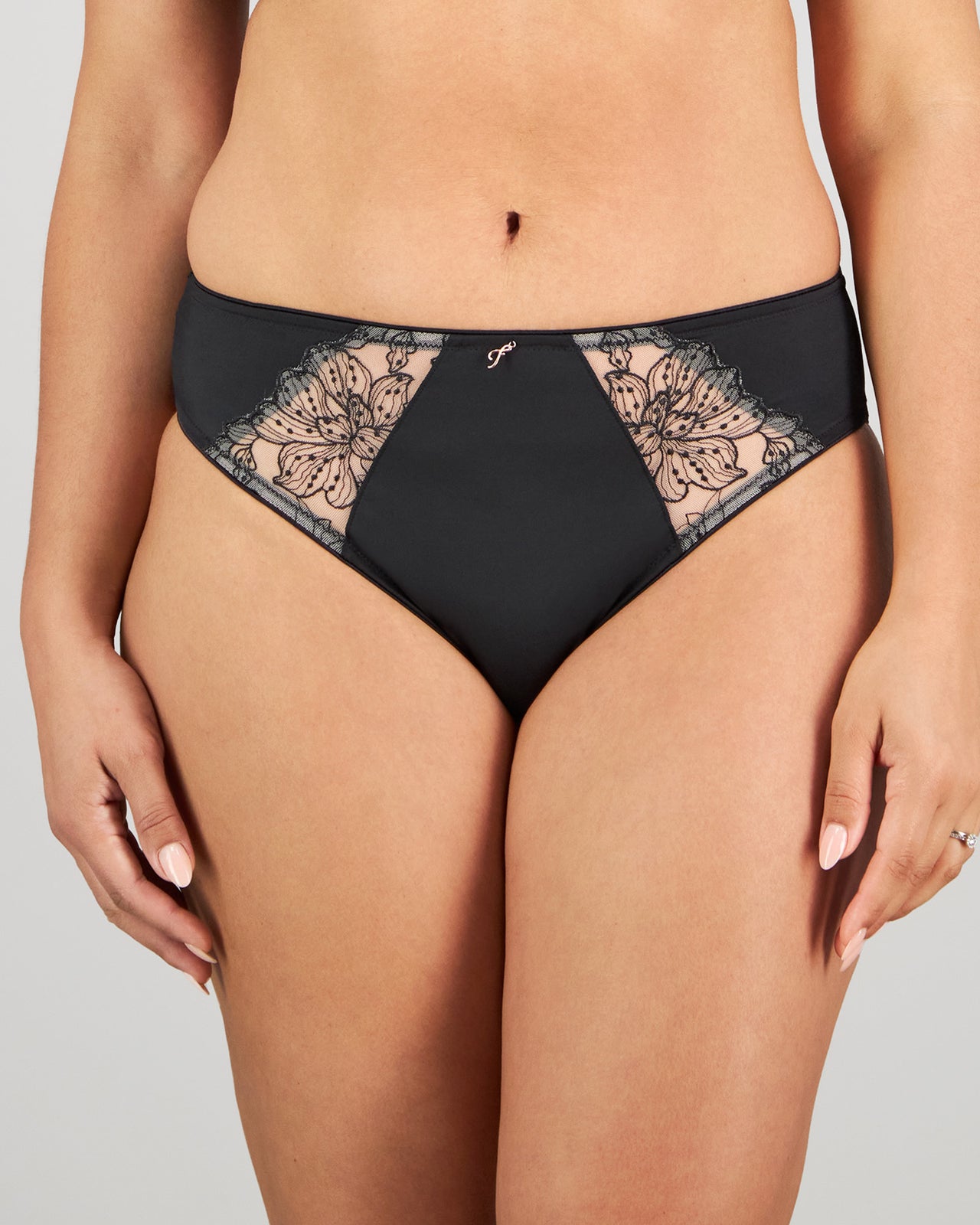 Model wears Magnetism High Cut Brief in BLACK/LATTE. On body front view