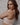 Model wears Bendon Restore Wire Free Front Opening Bra in LATTE. On body side view